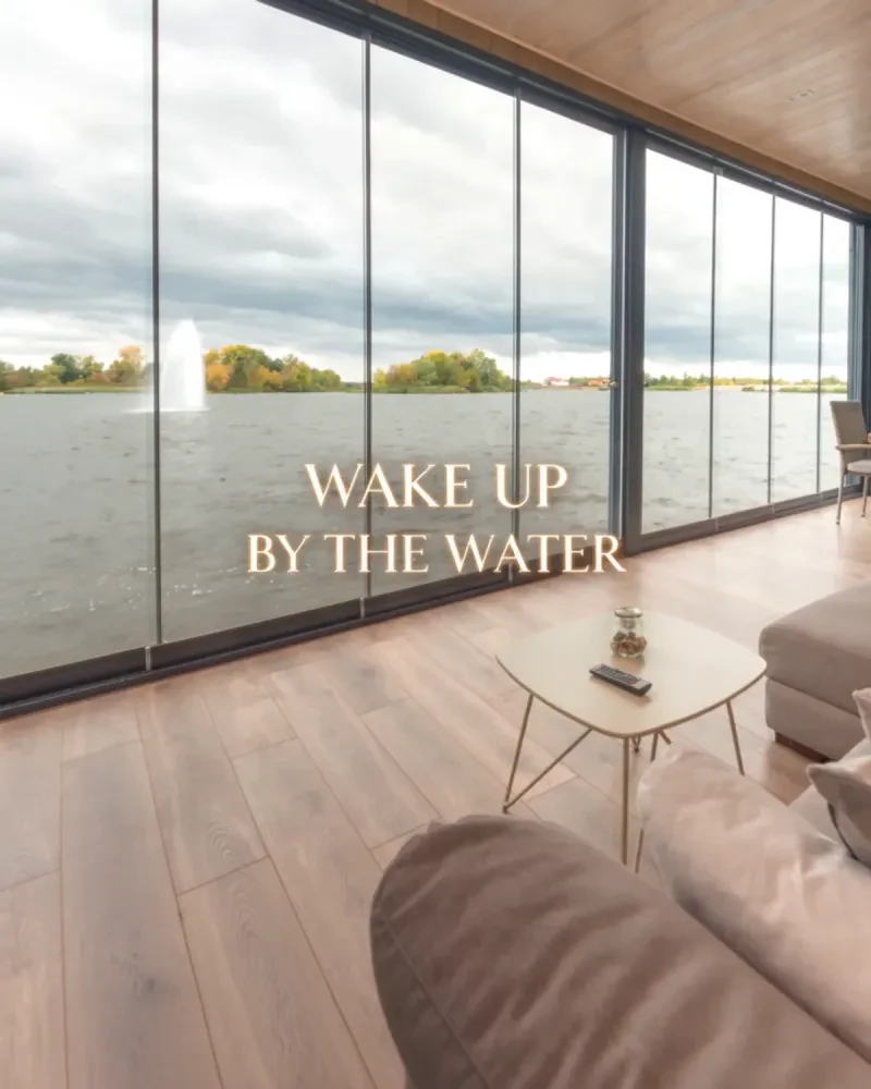 Floor-to-ceiling windows overlooking the lake from a vacation rental